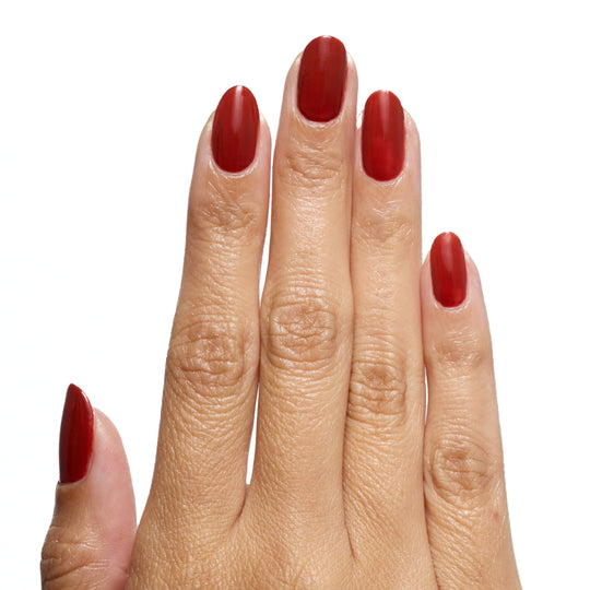 Flat hand wearing A Little Rusty Forever Wear polish